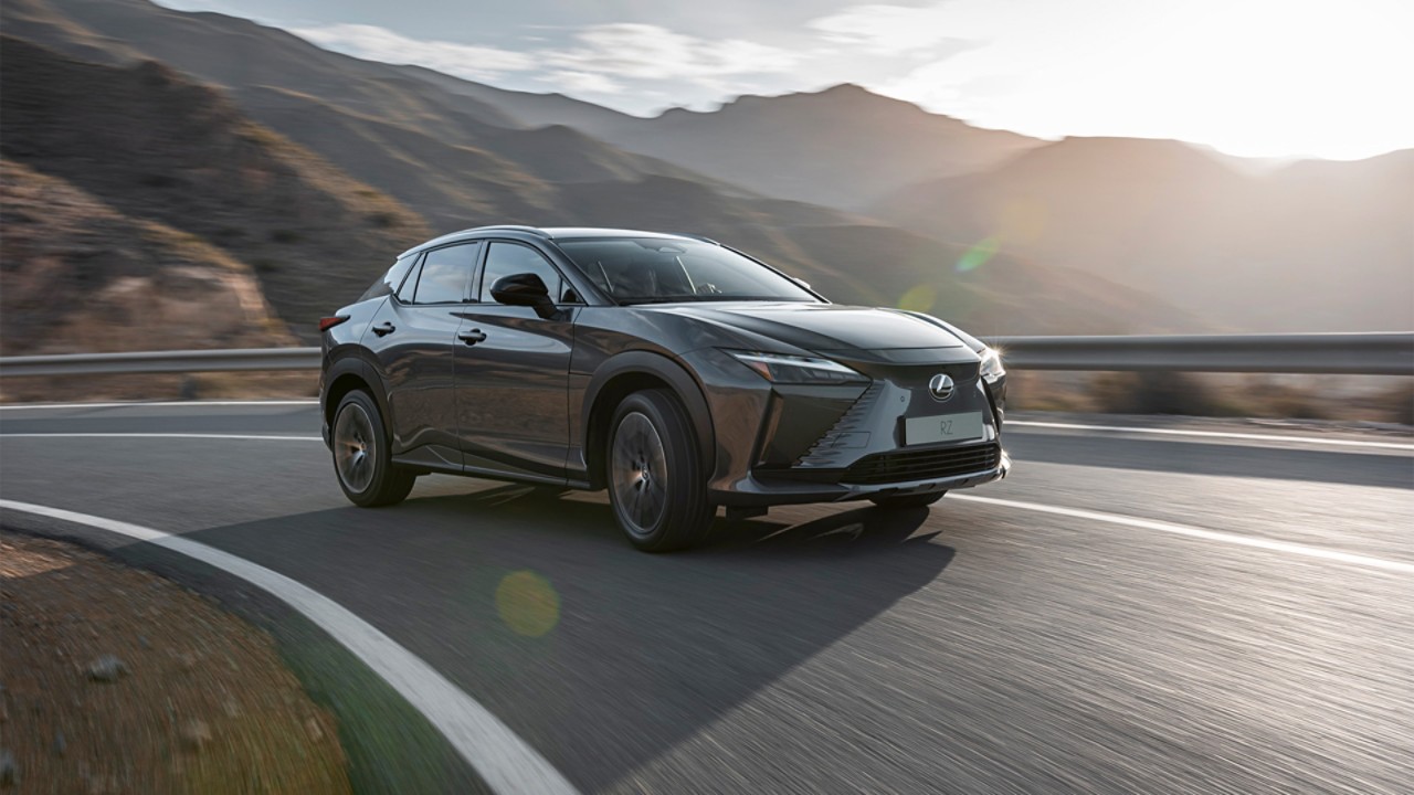 A Lexus RZ 450e driving in a mountainous location