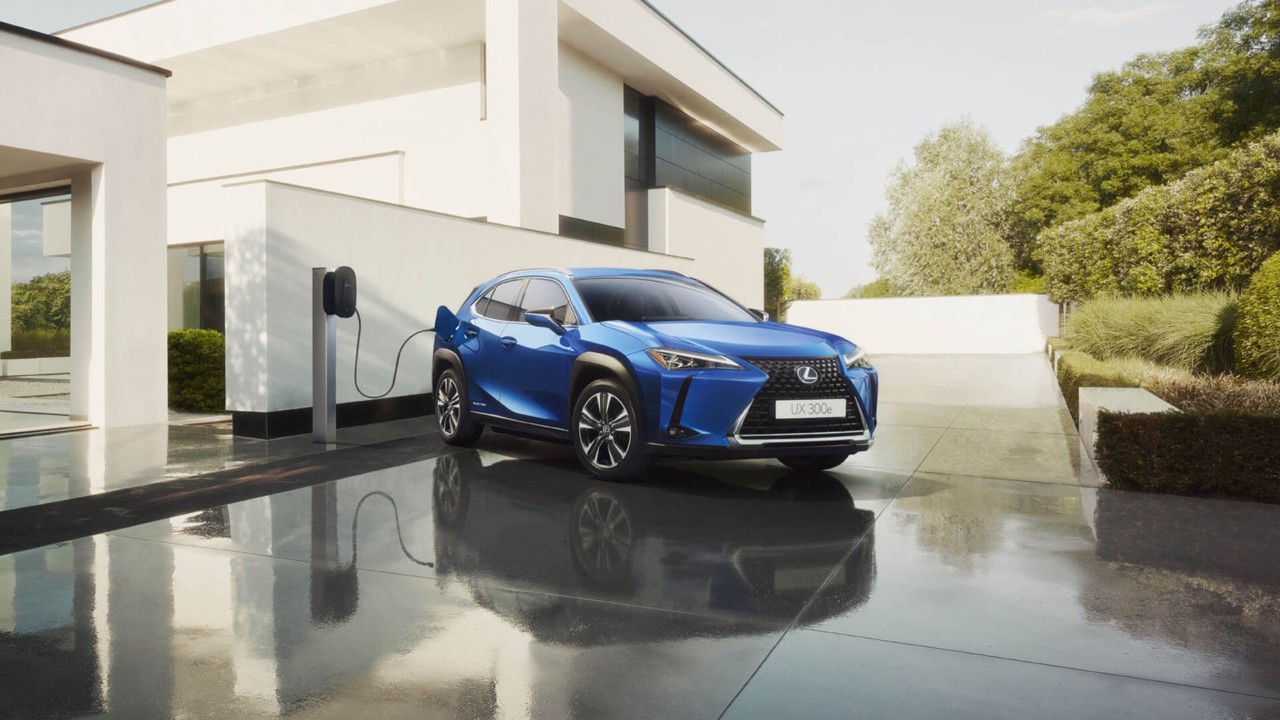 Lexus UX300e parked outside a house