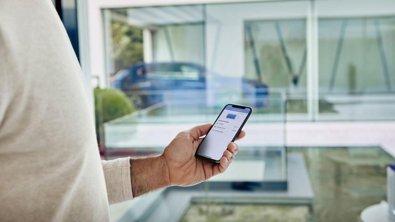 A person plugging in the Lexus NX 